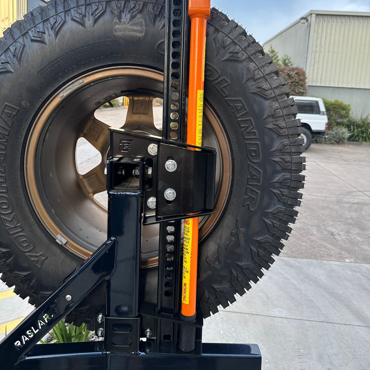 Rear Bar Hi Lift Jack [Sits between vehicle & carrier] - 76 Series